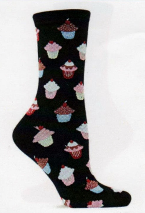 Hot Sox Womens Cupcake Socks start on Black background with Colored Paper Cups in different shades and Icing in White, Pink and Chocolate with a Cherry on Top.