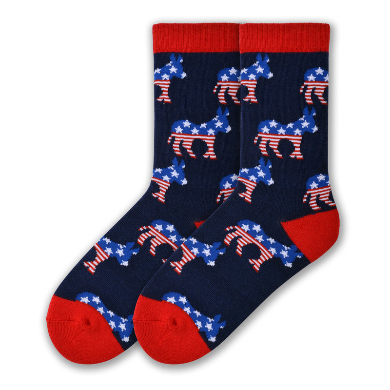 K Bell Womens American Made Democrat Sock starts on a Navy background with Red Cuffs, Heels and Toes. The Donkey is Blue with 5 Point White Stars on its Head and Back. Below starts the Red and White Stripes including the Tail all the way to the feet.