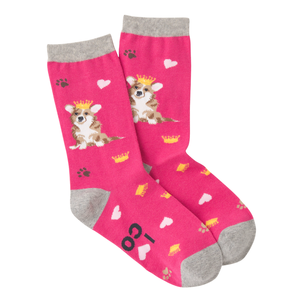 K Bell Corgi Sock starts on a Fuchsia background with Heather Grey Cuffs, Heels and Toes.  The Corgi is carrying a Crown of Gold on Her Head. Their are Gold Crowns and Pink Hearts all over the Sock. Also thrown in are Paw Prints in Black and Lion.  The Corgi is White, Lion, Seal Brown, Black for Nose and Eyes and Pink for Ears. On the bottom of the Sock, it reads, "I Love My Corgi".