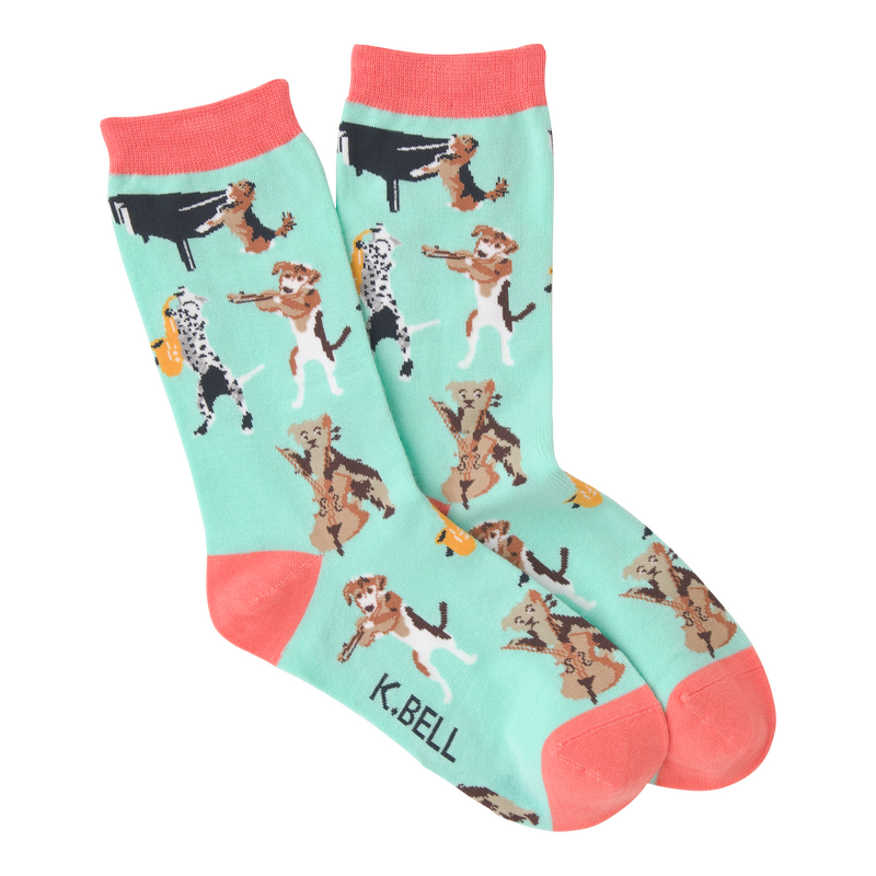 K Bell Musical Dogs Sock starts on a Teal background with Hot Coral Cuffs, Heels and Toes. In the Sock you will find several Dogs playing Instruments. A Piano, A Sax, A Violin and a Cello.  You never know they may end up playing with the neighbors! 