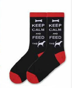 K Bell Keep Calm and Feed The Dog Sock is a Meme to the Keep Calm sayings of the world. It starts with a Black background with Bright Red Cuffs, Heels and Toes. Keep Calm and Feed the Dog is written in Bold White Print. The Dog is a Silhouette in White.