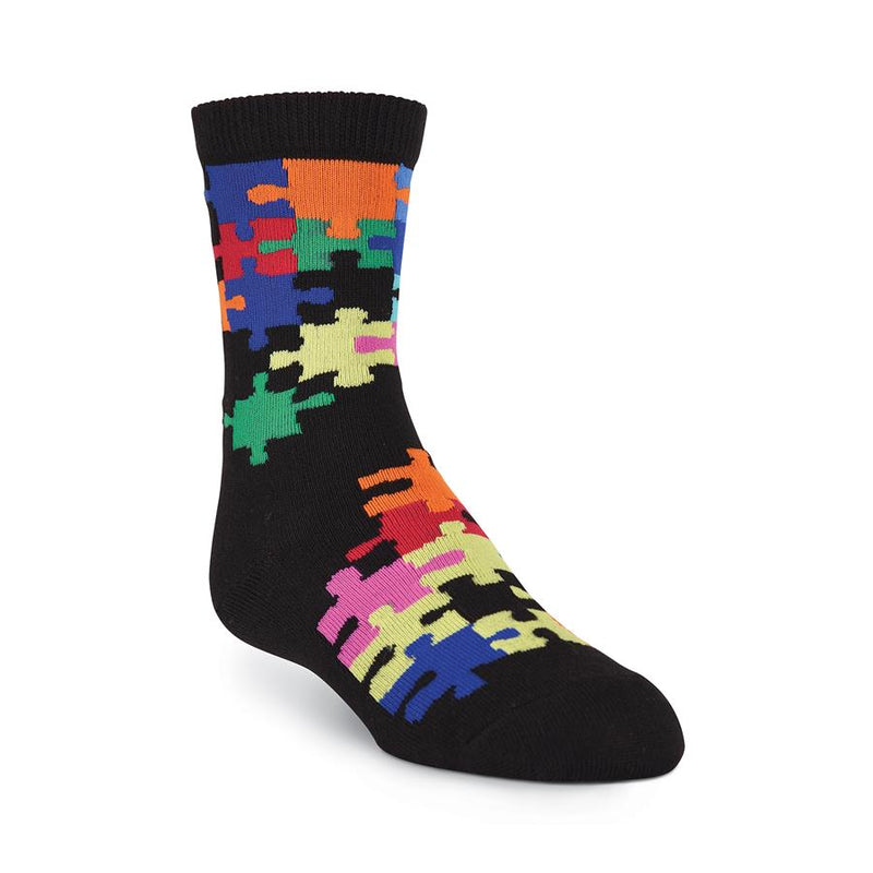 K Bell Kids Jigsaw Puzzle Sock starts on a Black background and has Jigsaw Puzzle Pieces in many colors over the Sock. Some colors are Red, Blue, Orange, Green and Lime.