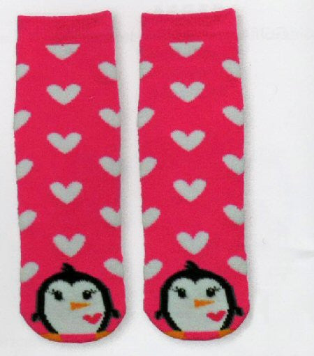 K Bell Kids Penguin Tube Non Skid Slipper Socks starts with an all Pink background with White Hearts all over. The Penguin is at the Toe made in Black and White with a Pink Heart.  His Nose and Feet are Orange