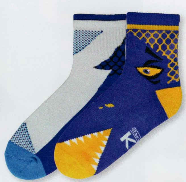 K Bell Mens Monster Bite Hi Top Crew Sock 2 Pair Pack is Lapis and Bright Yellow with a monster eye and mouth. The second pair continues the long monster with shades of Lapis White and Light Blue