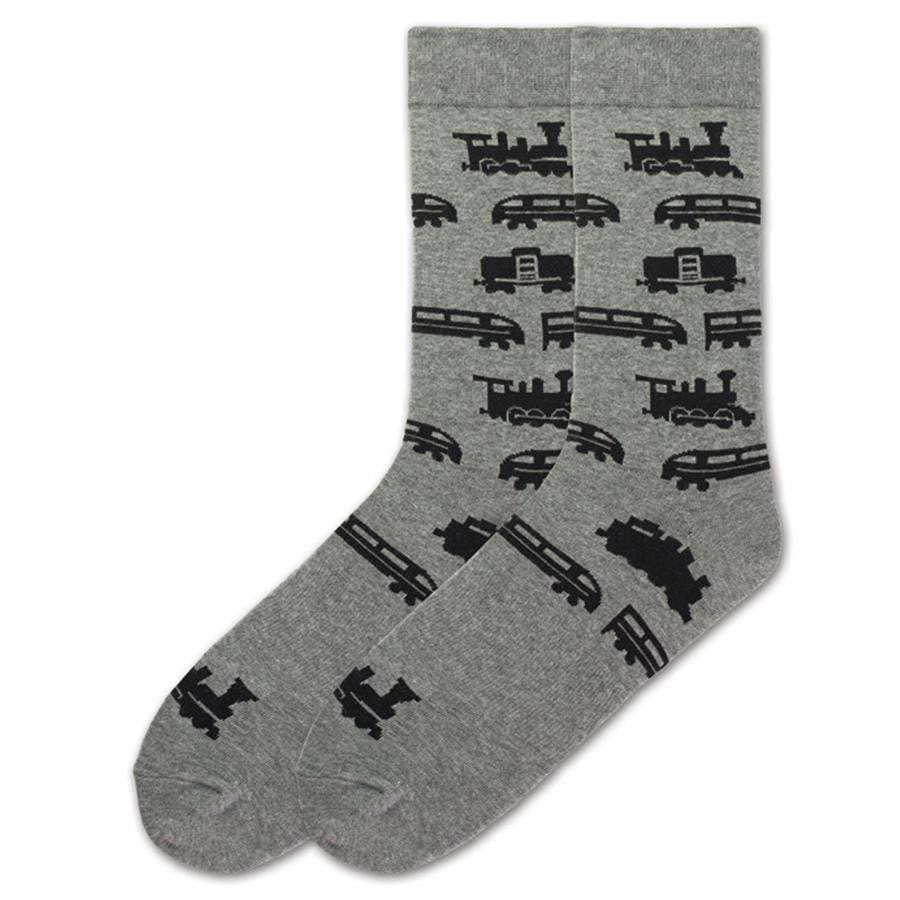 On a Heather Grey background K Bell puts different types of Trains on this Sock. All of the Trains are Black Silhouettes and they repeat down the Sock. First is a Steam Engine and then Passengers Trains next is a Caboose and it repeats.