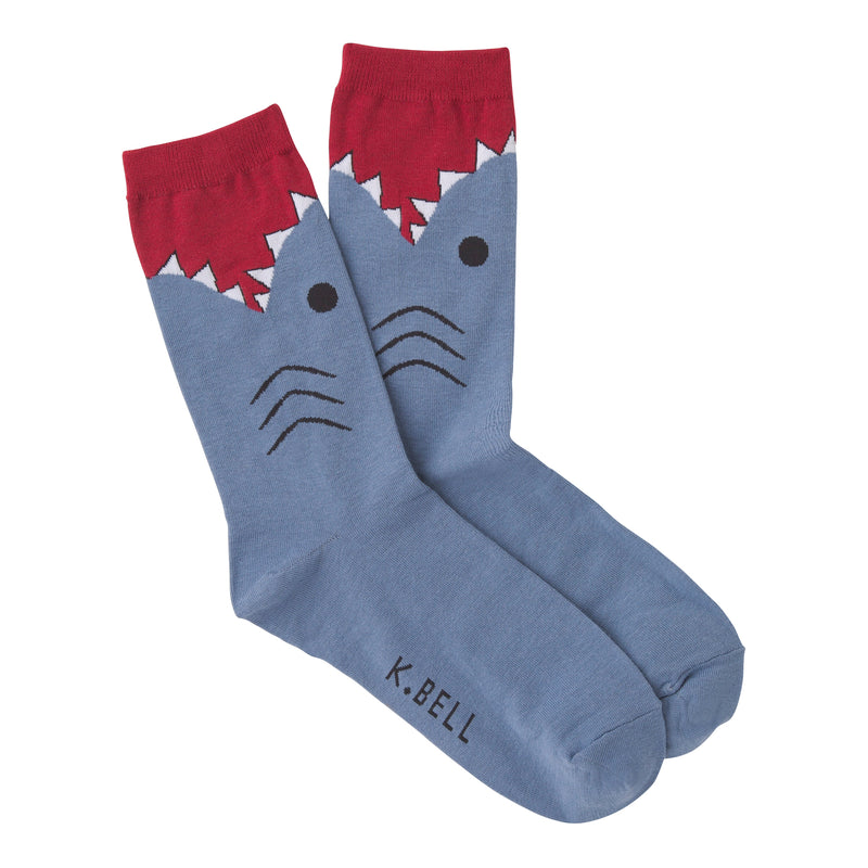 K Bell Womens Blue Shark Sock is Slate Blue with Black Gills and Eye. The Sharp Teeth are White with Black outlining. The Cuff is Maroon.