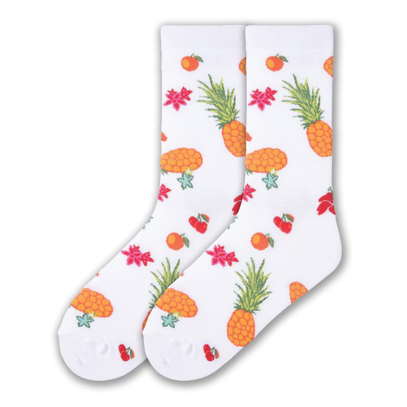 K Bell Tutti Fruitti Sock begins on a White background with colors of Bananas, Pineapples, Cherries, Oranges and Flowers of Orange, Red and Blue. 