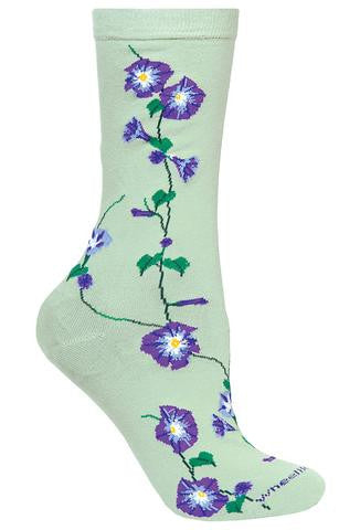 Wheel House Design Morning Glories Sock starts out on a Mint Green background. The Morning Glories run from right under the Cuff to the Toe. It is a Green Vine with Green Leaves. The Morning Glories are Purple with Black to separate Leaves. The inner Flower is Grey, White and Yellow.