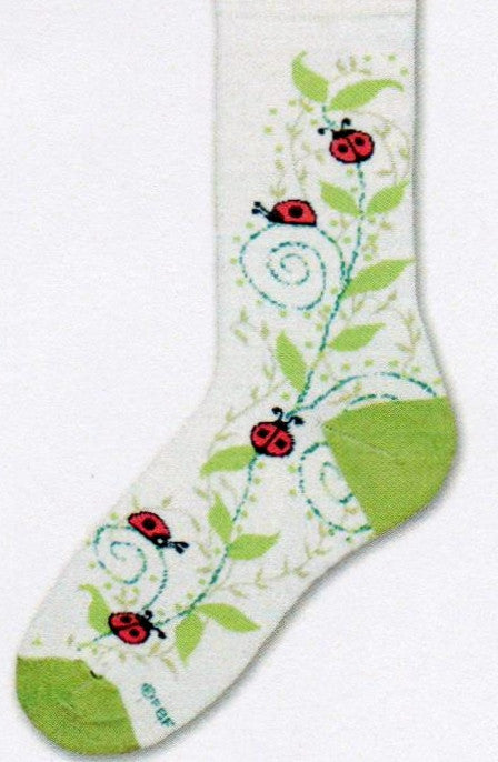 FBF Ladybug Swirls Socks are on a Bright White background with a Green Vine. The Red and Black Ladybugs are all around the vine. Looks like Spring and Country.