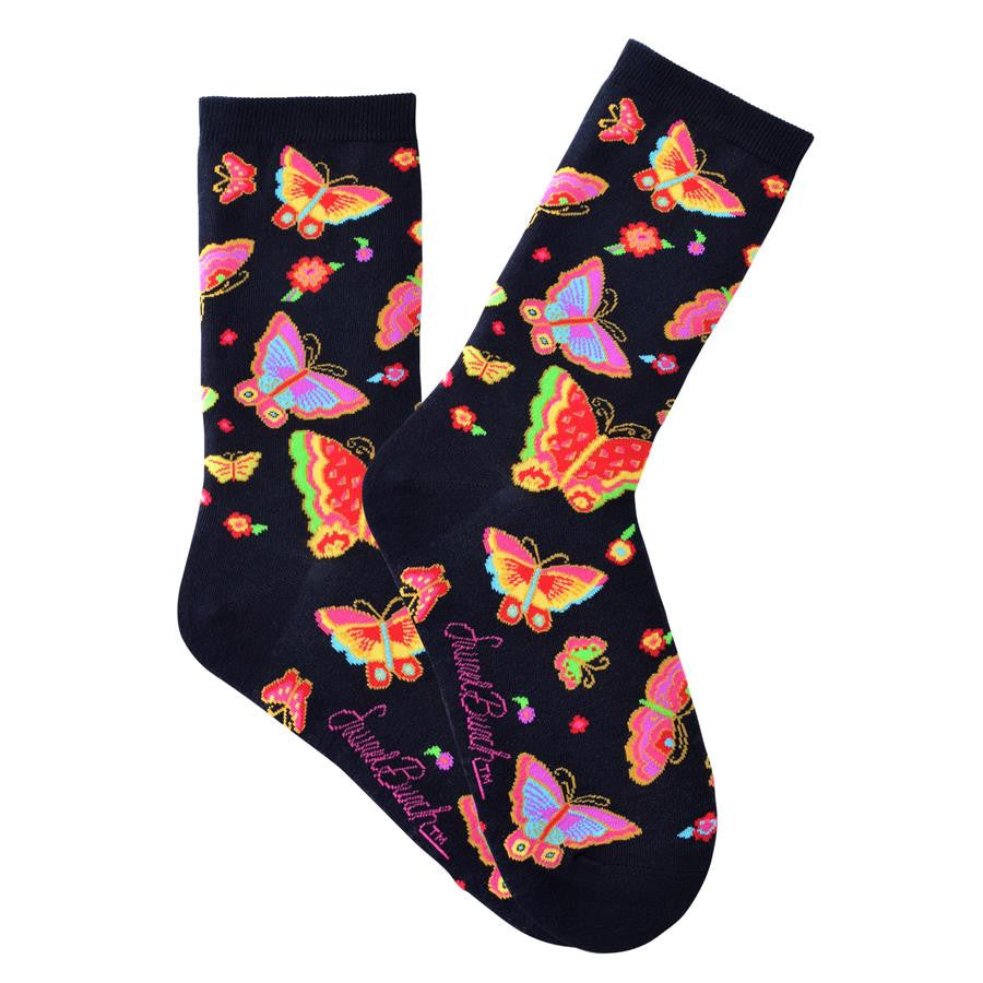 Laurel Burch Flying Colors is on a Black background with Brightly Colored Butterflies and Flowers all over the Sock. 