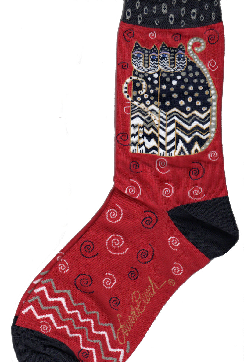 Laurel Burch Polka Dot Gatos in Red, this is the actual color of the sock. It is a brighter Red with Black Cuffs, Heels and Toes. Our Gatos are all Polka Dotted on top of their body and face. Zig Zags follow the bottom of the face and the body in Black White and Gold.  