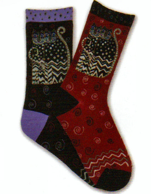 Laurel Burch Polka Dot Gatos Socks are both here in Black and Red. The Red in this photo is not quite bright enough. The scanned photo is better for color.