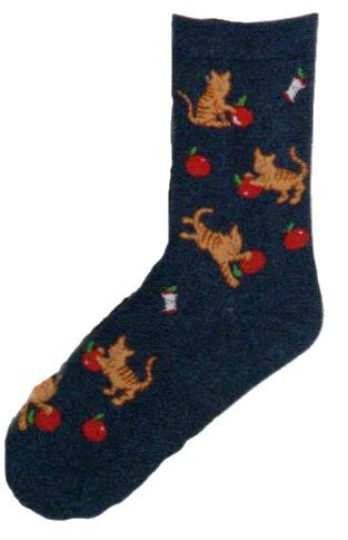 On a Dark Denim background a Brown Striped Cat is playing with a Bright Red Apple all over the sock.
