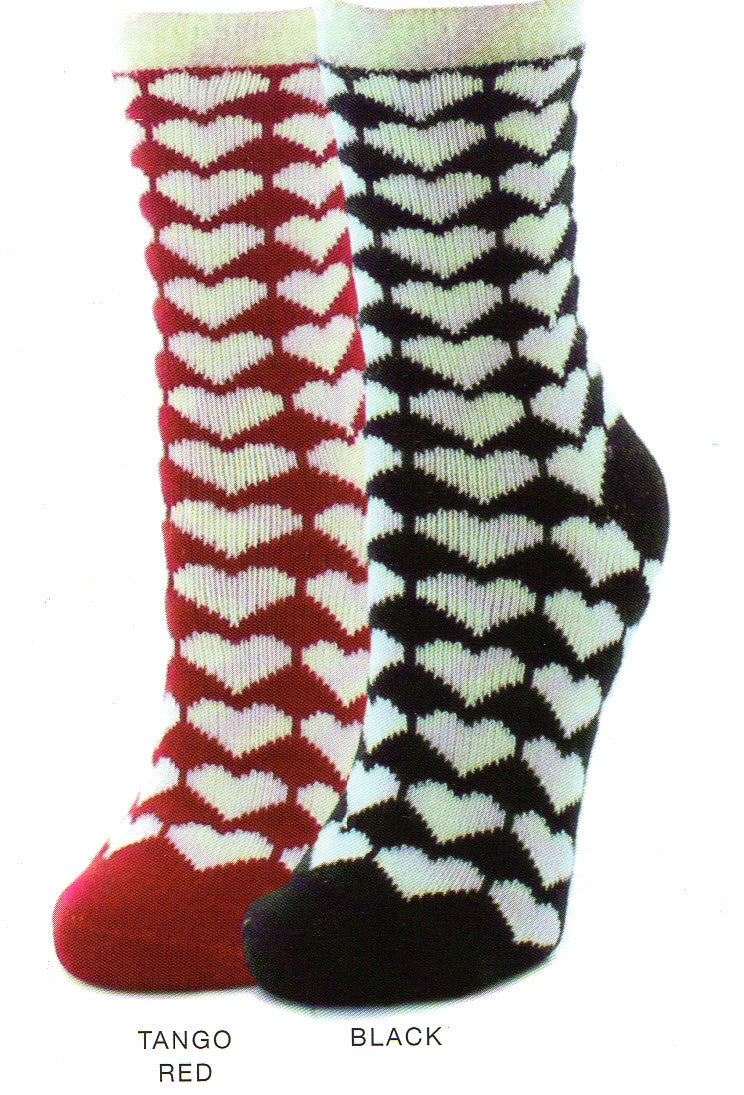 Me Moi Hearty Cozy Lined Sock comes in Two background Colors, Tango Red and Black. The Hearts are White and so are the Cuffs.  Tango Red's Heels and Toes are Solid. Black's Heels and Toes are Solid also. Non-Skid round buttons are on the bottom of these socks. The insides are lined with Cozy fluffy material.