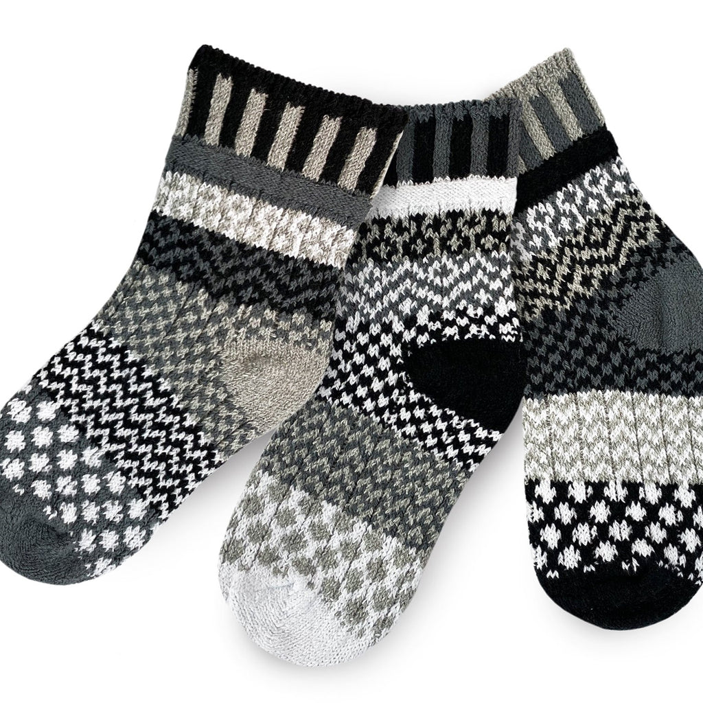 Solmate Kids Crew Moonlight Socks come in a Pair with a Spare.  Colors are Black, Grey and White lines and shapes.