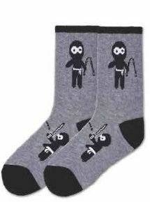 K Bell Kids Ninja Socks are started with a Charcoal Heather background. The Cuffs, Heels and Toes are Black. Below the Cuff on both sides is the Main Ninja with Nunchucks. On top of the foot are two Ninjas one with a sword the other with Nunchucks.