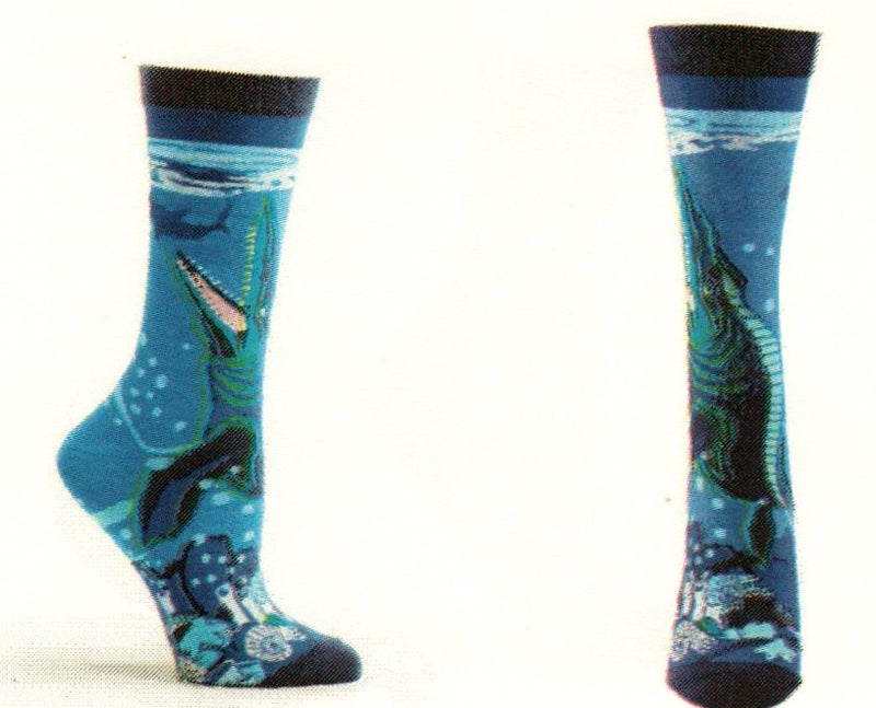 The Prehistoric Mosasaurus is the topic for this sock. All in Blues the Mosasaurus is Green, Navy and Black climbing from the bottom of the ocean floor to feed on its catch of the day!
