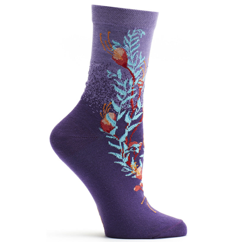 Ozone Blooming Kelp Sock Violet, the Kelp in many colors moves in the sock on a White background.