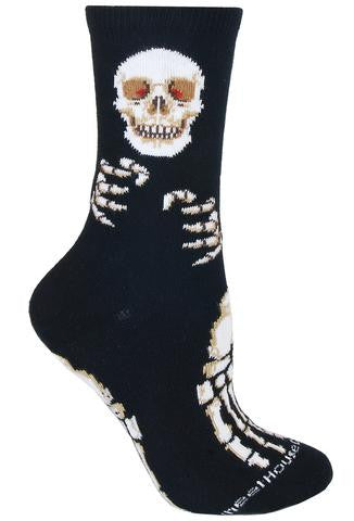 Wheel House Designs Skeleton Sock starts on a Black background. The Skull is on Top with Red Eyes. His Smile in Ivory welcomes you as his hands want to grab you. The feet want to run and take you away.