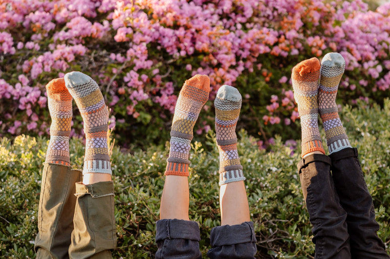 Solmate Adult Crew Olive Socks are shown with Models Upside Down.