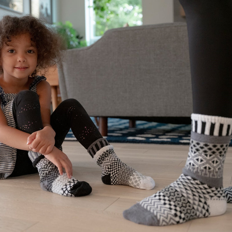 Solmate Socks Stellar Series Midnight on Right of Picture with Kids Crew Moonlight.