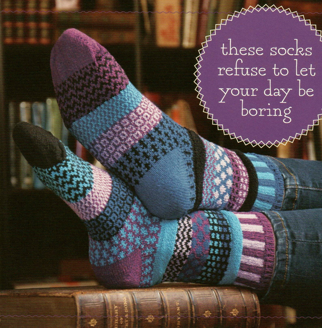 An Ad with Model from Solmate Socks wearing Vermont Garden Raspberry Sock.  