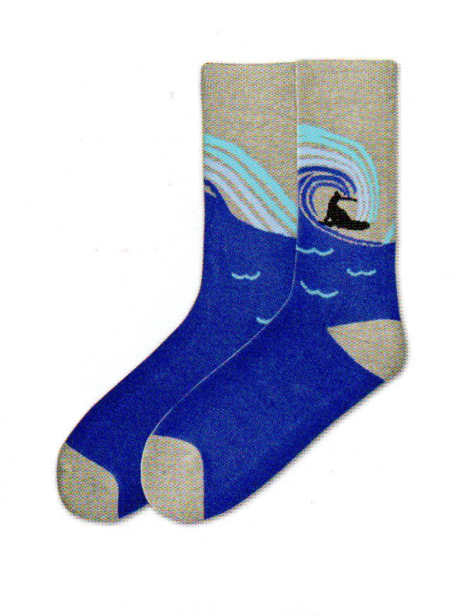 K Bell Mens American Made Surfs Up Novelty Sock starts with Grey at the Cuffs, the Heels and Toes are also Grey. Next comes Navy Blue background. The wave is Navy Blue, Sky Blue and Turquoise. The Surfer and Board are Black Silhouettes.