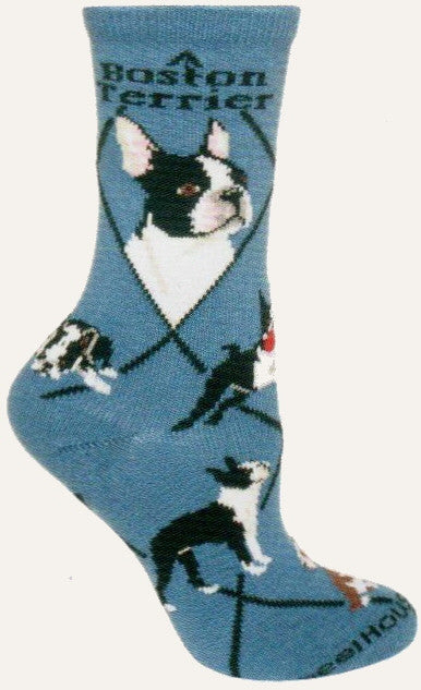 Wheel House Designs Boston Terrier is on a Blue background with Black Diamond Lines and Bold Print in Black reading, Boston Terrier below the Cuff. Next are the large Profiles of the Dog. Poses are of Dog Running with Red Ball in mouth, Stance for Show Dog, laying on his tummy legs to the side.