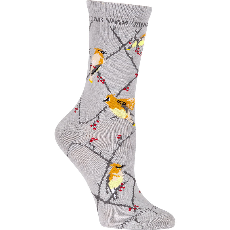Wheel House Designs Cedar Wax Wing on Grey Sock starts with the Lattice Argyle Diamond with Red Berries all over. The Cedar Wax Wing a Goldenrod, Yellow and Red tips on its wings that looks like wax that gives the bird its name. This bird flocks to this berry to eat.