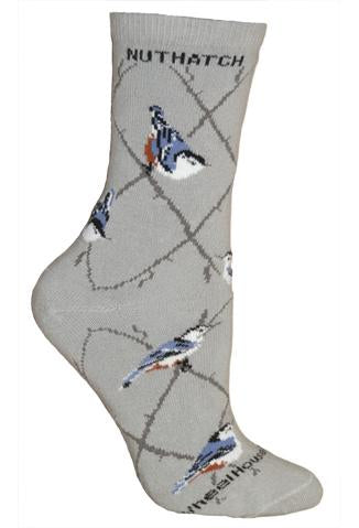 Wheel House Designs Nuthatch Sock is an Argyle Lattice with Nuthatch Birds resting on it. The Birds are Blue Grey and Black and White with a little dab of Chestnut on the bottom.