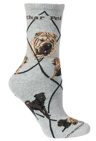 Wheel House Designs Shar Pei Sock starts on a Grey background with Black Diamonds. Shar Pei is on both sides of the sock in Bold Black Print. The Portraits are both mostly a Frontal view showing the rectangle face full of folds in Fawn and chocolate colors. The Poses are the same with an Apricot and Brown Shar Pei added. They are Standing, Sitting and Laying Down.