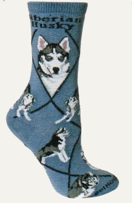 Siberian Husky starts on a Blue background with Black Lines and Bold print reading Siberian Husky on the Top. The Portraits are Black,White, Greys and Rose. The Poses are Standing, Sitting with Head up Howling, one walking toward you and one all curled up.