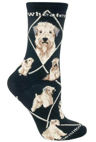 Wheel House Designs Wheaten Sock starts on a Black background with White Diamonds all over the Sock. Wheaten is in White Bold Print on both sides under the cuff. The Profiles are Frontal and Side Views. The Poses are Sitting, Standing, in a Show Stance and Laying Down. 