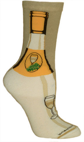 Wheel House Designs White Wine Sock shows a White Wine Bottle. In Yellows and Tans this Sock looks like a bottle with a Logo on it with White Wine and Green Grapes. Below on the Foot is another Glass of Wine.