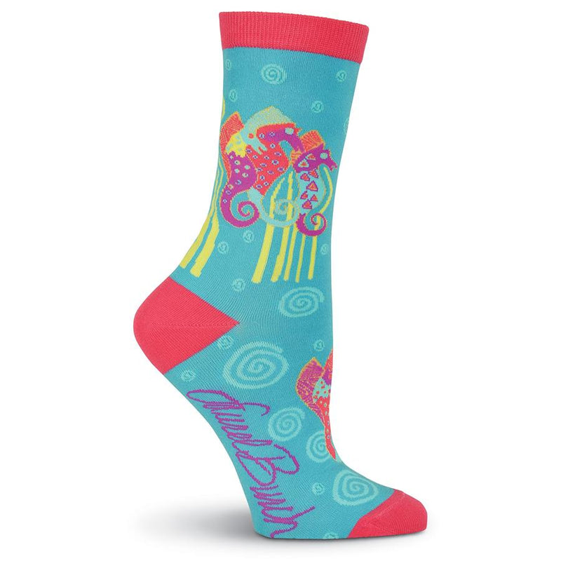 Laurel Burch Seahorse Socks start on a Turquoise background with Scarlet Cuffs, Heels and Toes. The Seahorses curl their Tails around Lime Vegetation on the Seabed. The Seahorses vary in different ways but all have the same colors of Scarlett, Lime, Magenta and Gold.