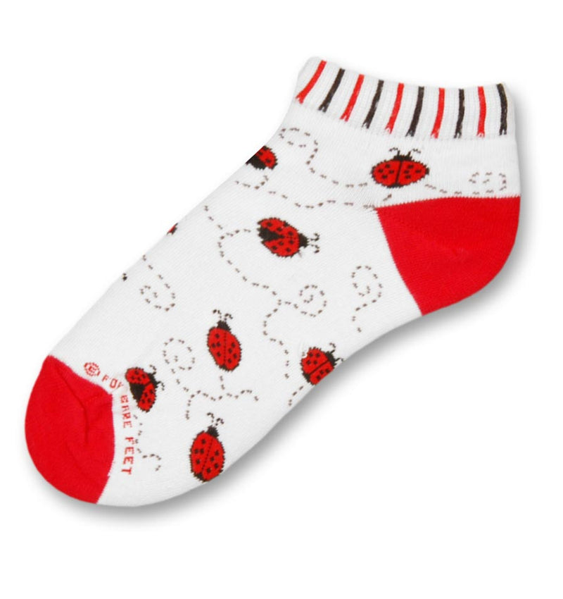 FBF Ladybug Sock is an Anklet/No Show Style Sock with the Cuff in Vertical Rows in Red, White and Black, The background is Bright White with Red Heels and Toes. Red and Black Ladybugs are following a track from place to place.